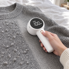 White FuzzAway removing pilling from a grey knit sweater