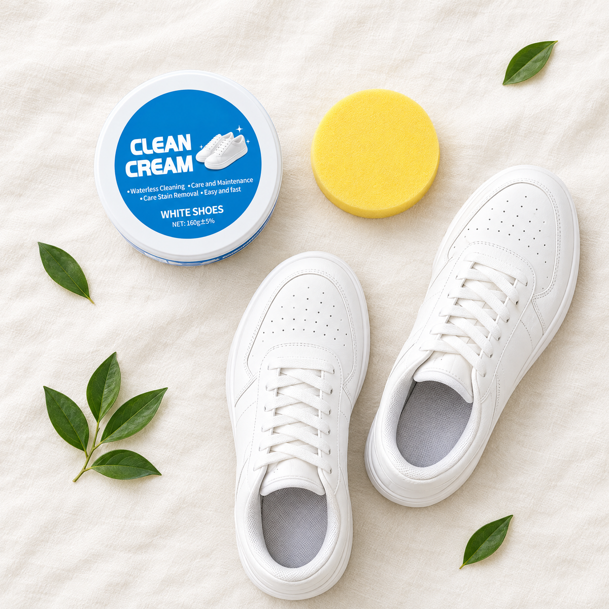Shoe cleaning cream, sponge and clean white sneakers flat lay