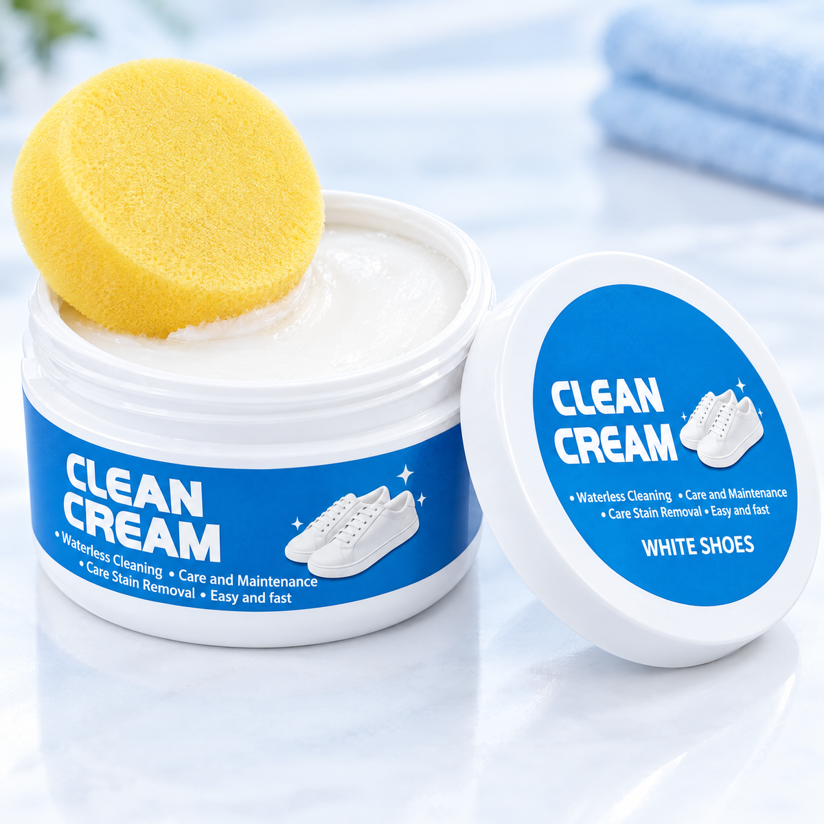 Open tub of white shoe cleaning cream with the free sponge