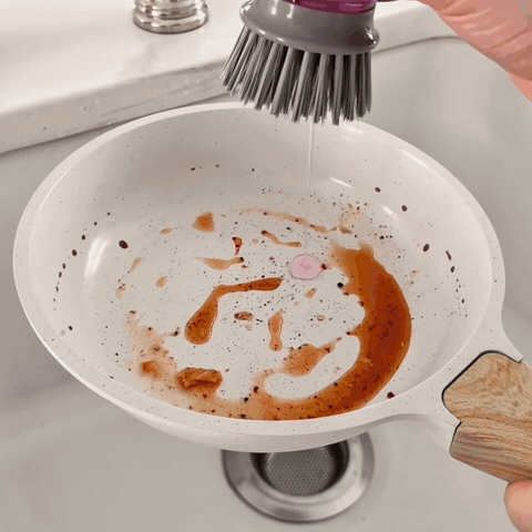 SudsPress scrubbing a greasy pan clean